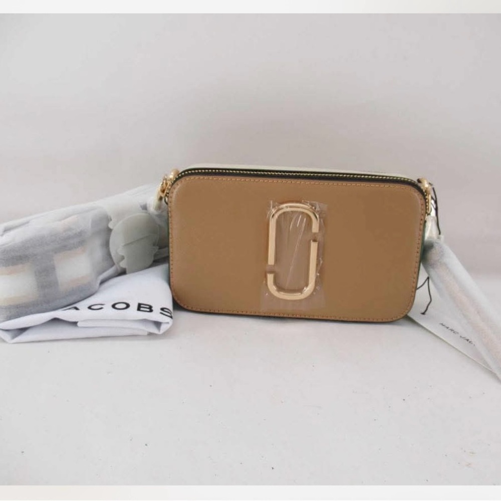 Marc Jacobs Cream Crossbody Bag with Structured Design and Metallic Detail
New